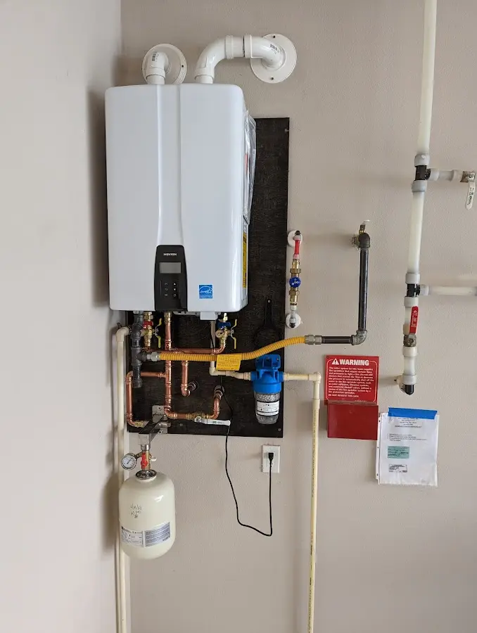 Professional plumber installing copper piping in a Anaconda-Deer Lodge County home